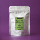 Envase Doypack plateado de Hojas de Palto Amman Tea Blends para combatir la fatiga y el insomnio, sobre fondo morado.