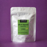Envase Doypack plateado de Sen de Alejandría Amman Tea Blends, laxante natural, sobre fondo morado.