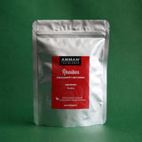 Envase doypack de infusión Rooibos sin cafeína de 50g marca Amman Tea Blends sobre fondo verde.