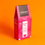 Caja de té verde Mandala Amman Tea Blends en envase rosado con lavanda y albahaca, infusión herbal relajante y aromática.