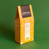 Caja de té verde con cedrón Amman Tea Blends en envase amarillo, infusión natural de hierbas con aroma suave y relajante.